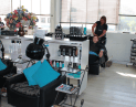 Client receiving a hair wash from a Hair Frame stylist in Somerset West salon.