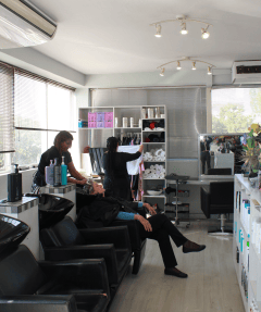 A lady getting her hair washed at Hair Frame in Somerset West